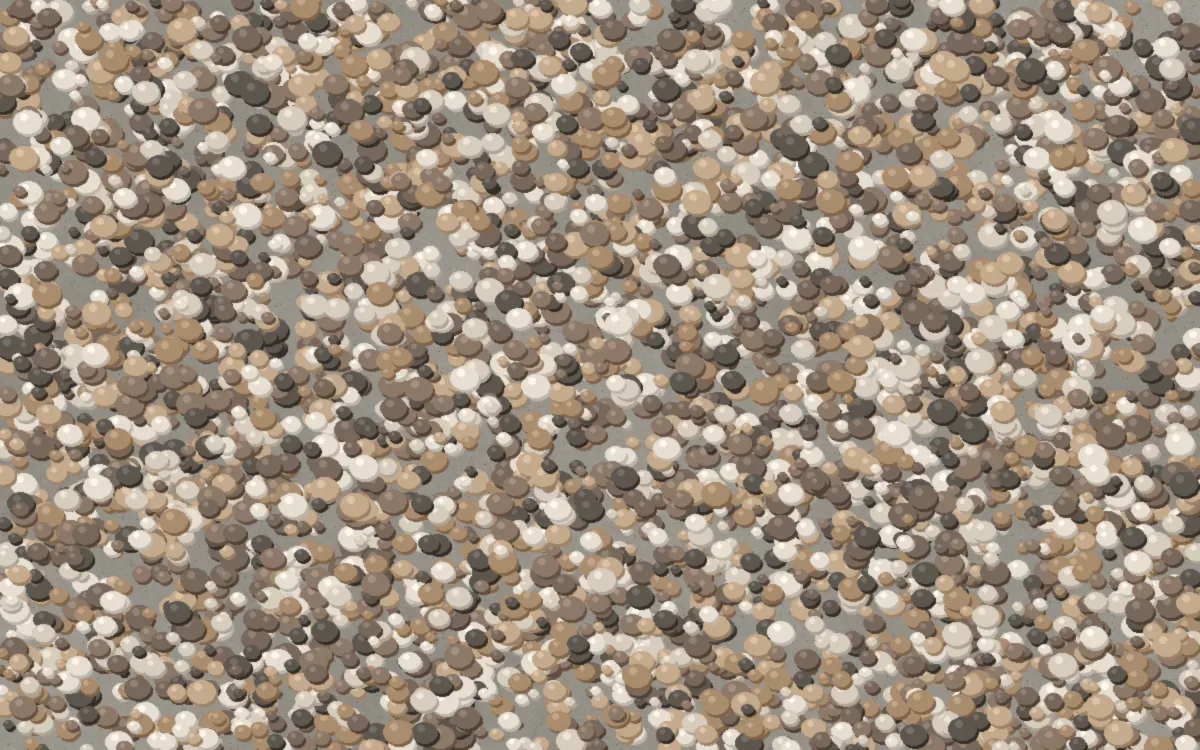 Close-up of an exposed aggregate concrete finish with rounded stones showing