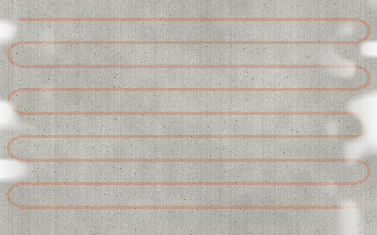 Illustration of heated driveway tubing layout under concrete with snow melted off the surface